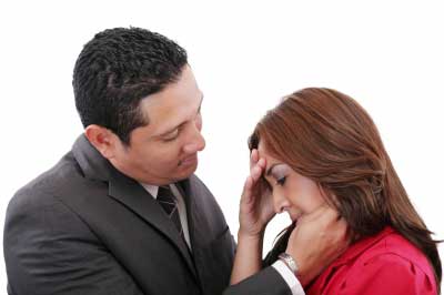 Man comforting woman in a love relationship