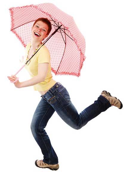 woman dancing with umbrella feeling good