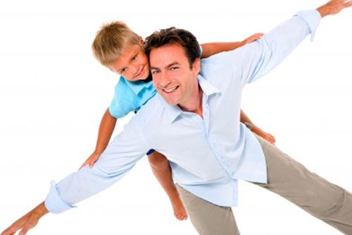 child experiencing importance of a father by enjoying ride on his back