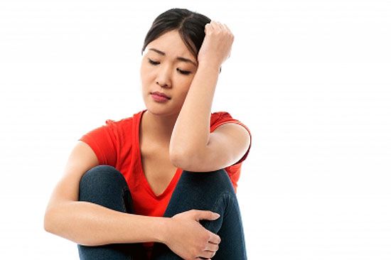 Girl sitting with teenage depression