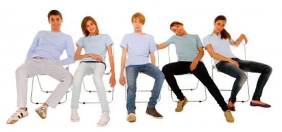 Young kids sitting in poor posture