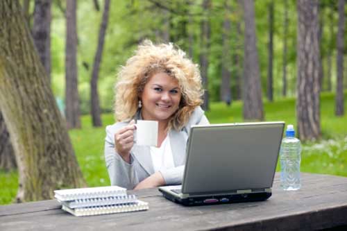 woman enjoying quality of life with office in nature