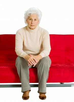 A senior lady sitting safely on sofa
