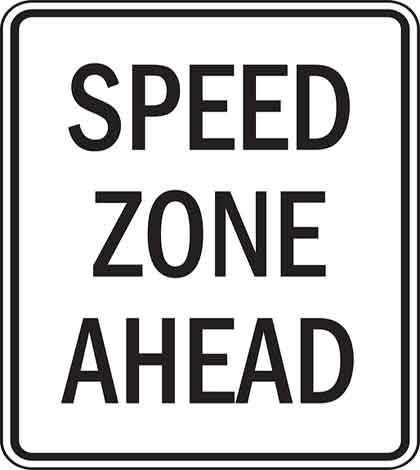A site speed test sign board with speed zone ahead written