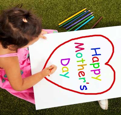 Child making Happy Mother's Day card for mom