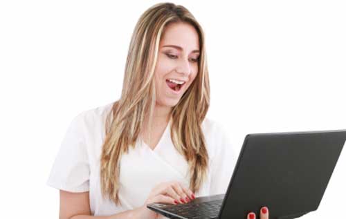 A woman happy reading a blog