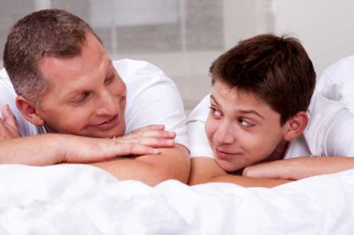 Father celebrating Fathers Day with teen son