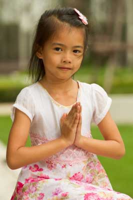 A girl praying for peace on earth