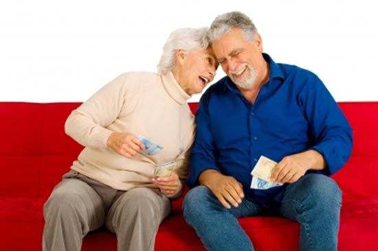 Old man and woman with money in hand and happy