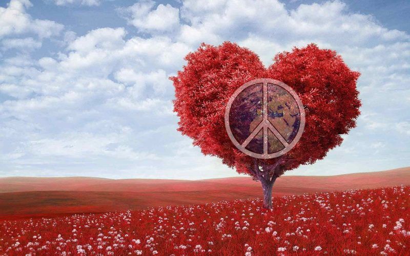 A red tree in the shape of heart with the world peace symbol inside