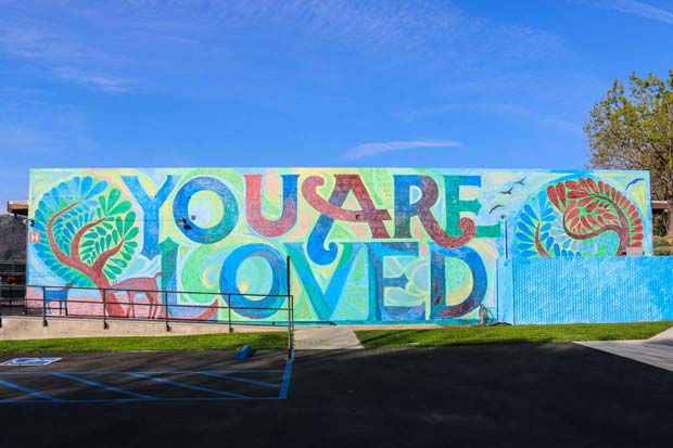 Mural on the wall with you are loved written on it
