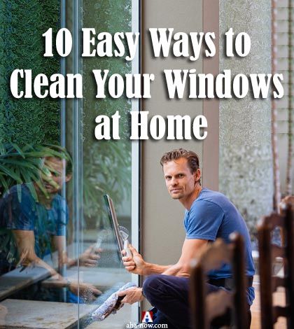 man sitting and cleaning windows at home