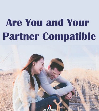 Two man and woman as compatible partners sitting on a field