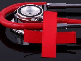 Stethoscope and a red cross
