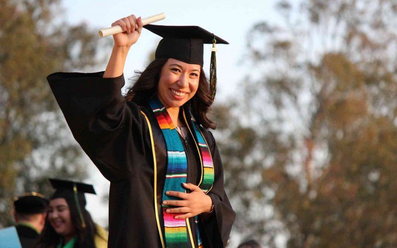 A woman college graduate completing college education