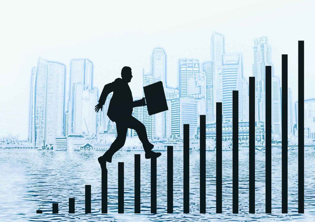 Clip-art of man with briefcase in hand climbing the corporate ranks ladder