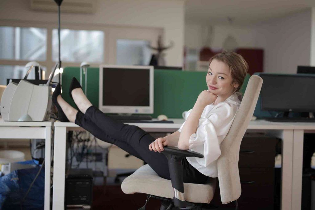 Woman resting in office getting things done by useful services