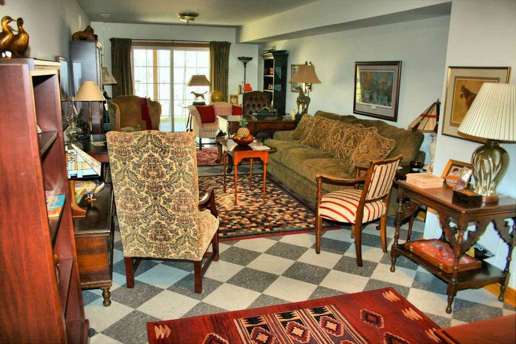 A family room decorated with rugs