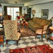 A family room decorated with rugs