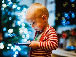 Kid having screen time with mobile in hand