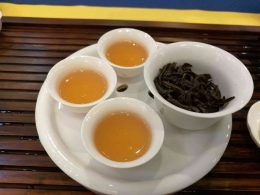 Oolong tea in cup with the tea leaves