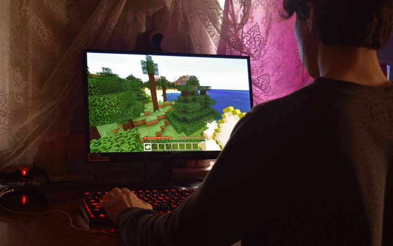 A boy playing MMORPGs on computer