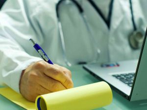 An online doctor writing a medicine prescription