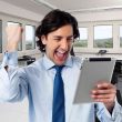 A contractor man happy with success inside an office