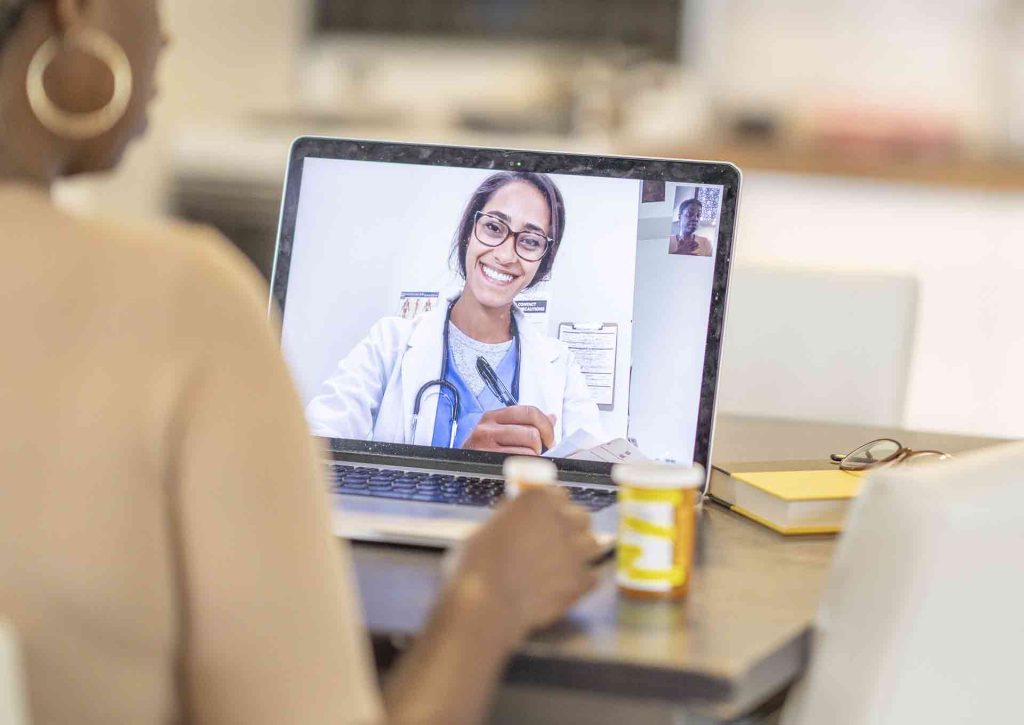 Telehealth doctor on patient's laptop