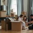 Husband, wife, and kid busy moving house