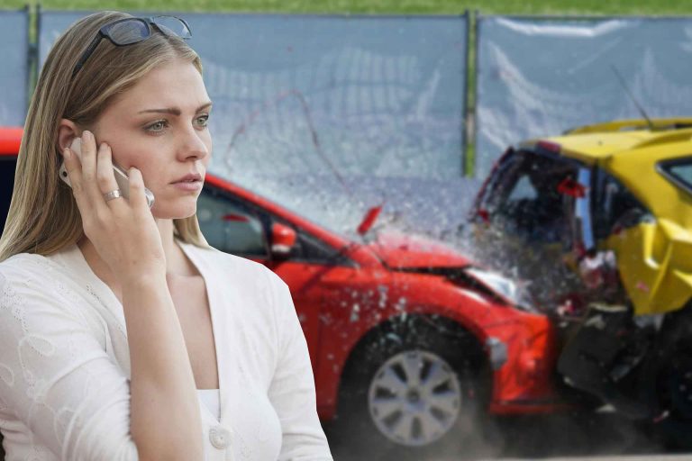 Woman calling on mobile after a car accident