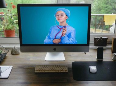 Doctor on desktop video call offering telehealth services
